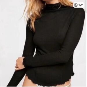 Free People Black Turtleneck w ruffle trim. Size small